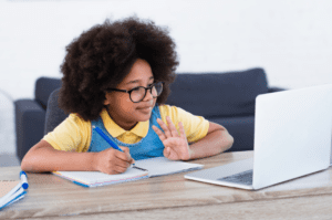 Cute little girl working on online learning sites